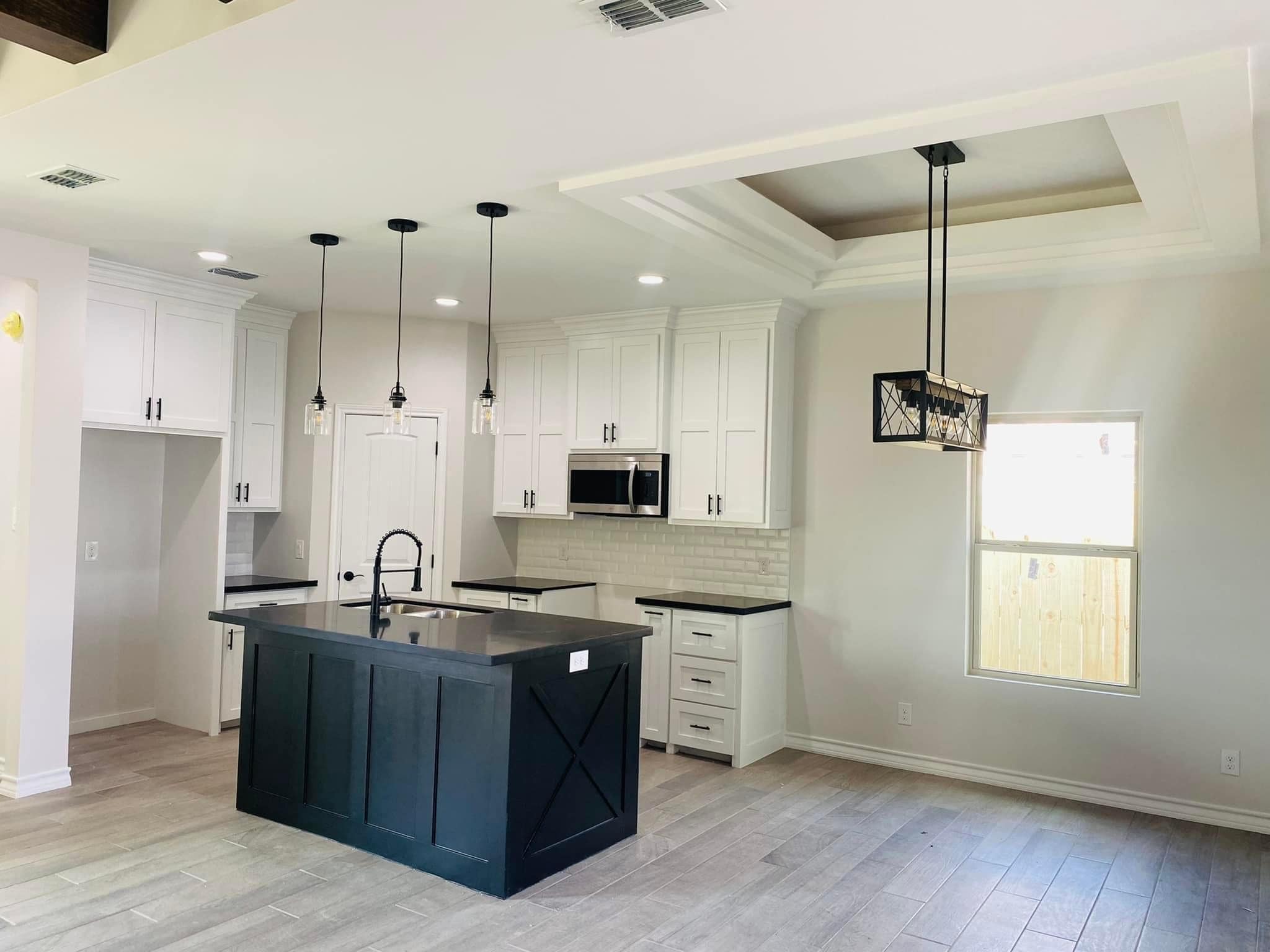 Custom Home Kitchen — White Shaker & Black Island